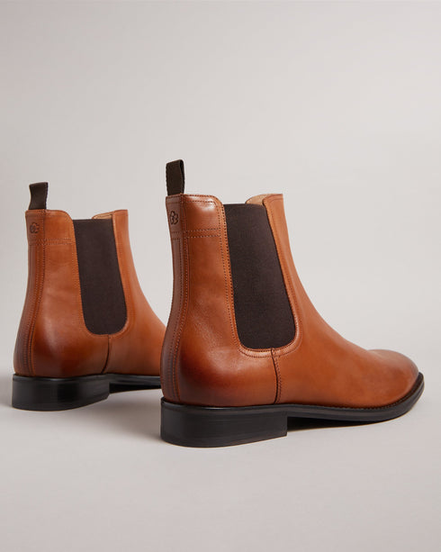 MAISONN-Boots-Step into pure luxury in leather and cotton. MAISONN are a stylish and versatile pair of chelsea boots with timeless appeal. These boots offer a sharp accent to any outfit and are finished with a subtle debossed magnolia on the heel. By purchasing this product, you are supporting responsible leather manufacturing through the Leather Working Group Chelsea boots Leather Pull tab Fully lined Closed round toe Elasticated ankle panel Ted Baker branded- Ted Baker Romania
